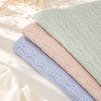 Tissu jacquard tricoté chaîne à texture florale micro-extensible, très demandé, pour robes, hauts, chemises et vêtements de mode féminins