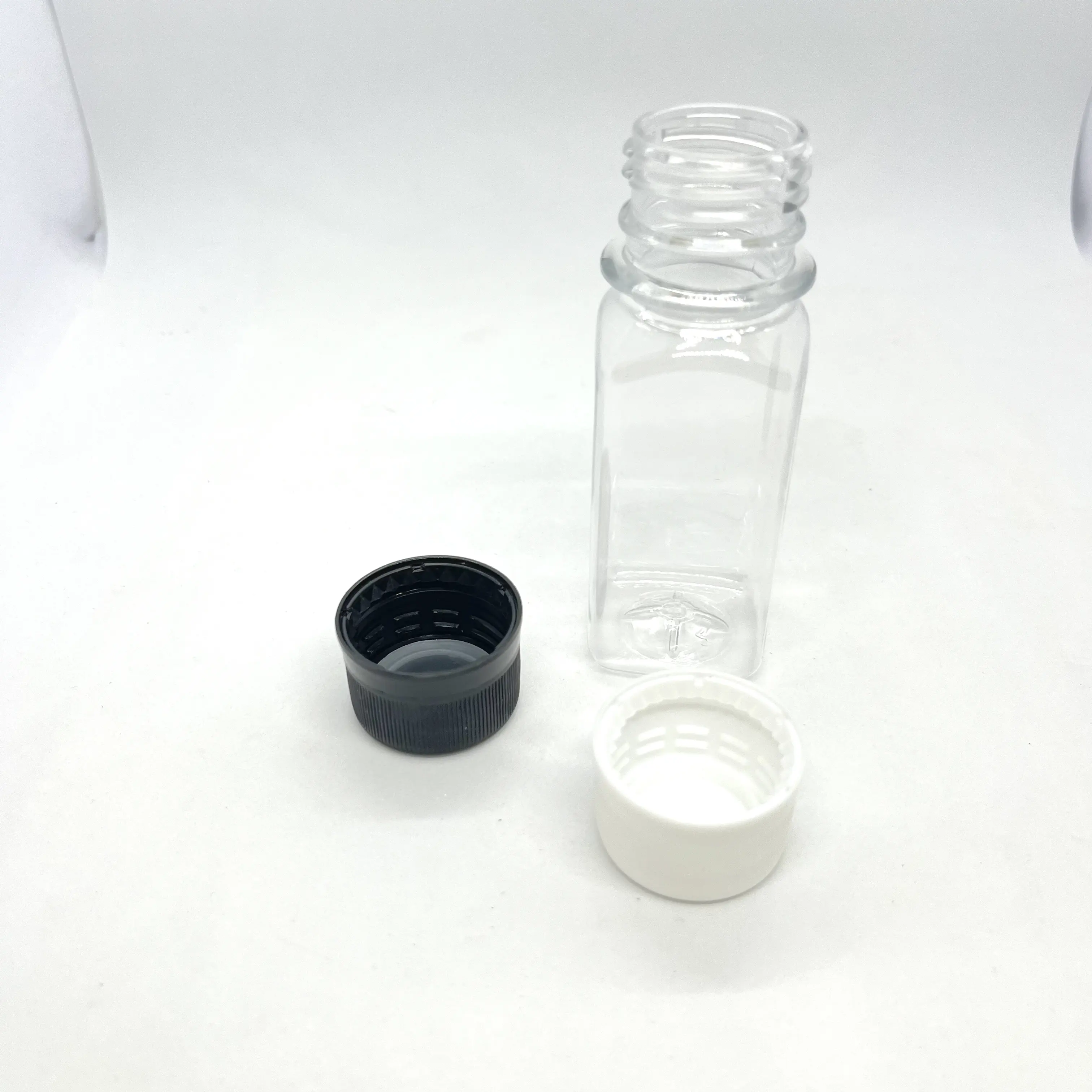 زجاجات بلاستيكية PET 2 أونصة صينية على شكل لقطة الزنجبيل للبيع/أكثر مبيعًا زجاجات فارغة 60 مل عينة عصير آمنة للأطعمة
