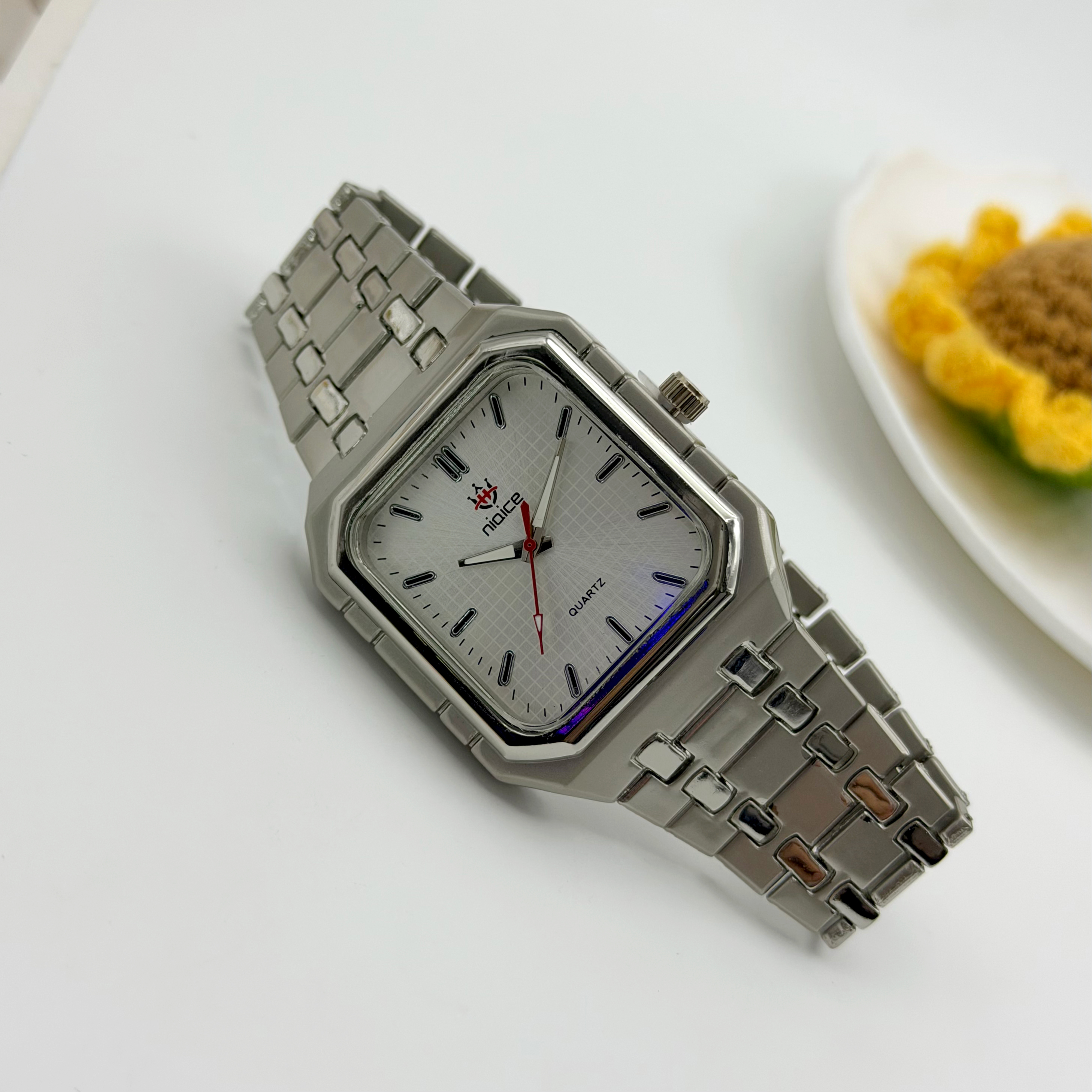 Silver belt and white plate