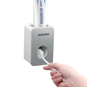 Disesuaikan menerima dinding desain baru plastik kamar mandi otomatis tangan bebas sikat gigi pasta gigi pemeras Dispenser