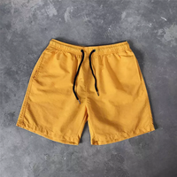 Pantalon imprimé de logo personnalisé Vêtements de plage d'été de couleur pure Short de bain pour hommes avec poche Vente en gros Vêtements de sport amples