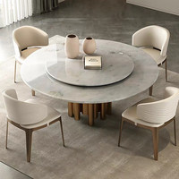Table à manger italienne de luxe en marbre avec un dessus rotatif et une base en métal irrégulière adaptée au salon
