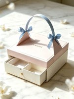 Boîte cadeau portable rigide en forme de valise avec ruban en satin, nœud, gaufrage, estampage à chaud et structure à tiroirs multi-compartiments pour faveurs de mariage