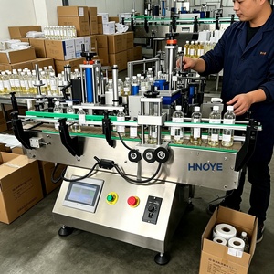 Applicateur d'étiquettes rondes semi-automatique pour bouteilles <span class=keywords><strong>de</strong></span> vin, d'huile d'olive, <span class=keywords><strong>de</strong></span> miel et <span class=keywords><strong>de</strong></span> <span class=keywords><strong>confiture</strong></span> - Product Image 1
