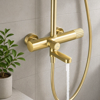 Robinet de douche électrique mural monotrou de luxe moderne en laiton et alliage de zinc finition or brossé chaud/froid céramique pour hôtel