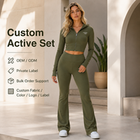Conjunto de dos piezas al por mayor para mujer: Sudadera corta con cremallera de manga larga de algodón y elastano, y pantalón acampanado de cintura alta ajustado para entrenamiento.