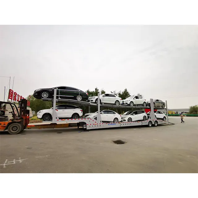 Das hydraulische doppelte stahlgestell SAF Achs-Auflieger hergestellt in China wird verwendet, um 10 neue Energiefahrzeuge zu transportieren