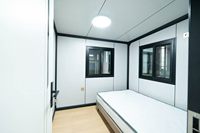 Maison préfabriquée abordable à montage rapide, à double aile extensible, avec balcon, pour chantier de construction et maison de vacances