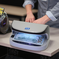 Détecteur de billets portable UV LED DC-09 en gros, rechargeable, avec fonction marche/arrêt automatique, pour la vérification des passeports et des cartes de crédit
