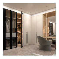 Armoire de chambre intégrée haut de gamme avec cadre noir personnalisé, éclairage LED, portes coulissantes et coiffeuse intégrée