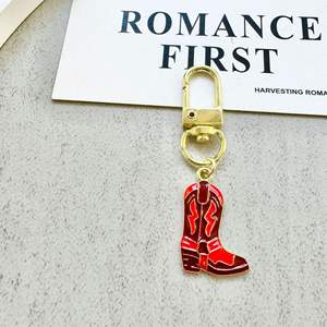 พวงกุญแจโลหะรูปคาวบอยตะวันตก สีแดงทอง ลายหัวกระทิง พร้อมรองเท้าบูท ดีไซน์สร้างสรรค์ น้ำหนักเบา สำหรับห้อยกระเป๋า - Product Image 4