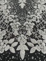 Tissu en dentelle perlée en gros avec broderie de paillettes brillantes sur tulle pour robe de mariée femme