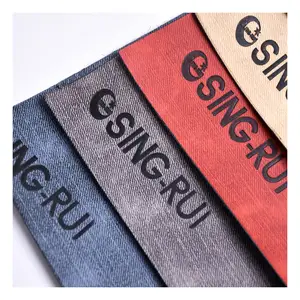 מחיר טוב הסיטונאי מפעל לחץ שינוי צבע באיכות גבוהה מלאכותי בד עור עבור מחברת וג 'ינס תווית