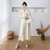 Robe longue élégante en maille patchwork à manches longues pour femme 2026