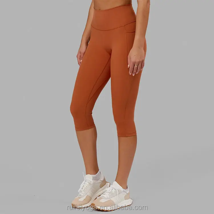 Özel çevre dostu Polyester elastan yumuşak kadınlar spor Yoga pantolon tayt hiçbir ön dikiş yüksek bel 3/4 tayt ile cep