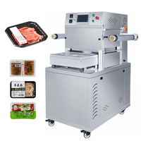 Machine à sceller les barquettes à table coulissante avec plateau pour cartes, arbre de récupération de film et arrêt d'urgence, pour l'emballage alimentaire