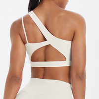 Sujetador deportivo asimétrico de un solo hombro para mujer al por mayor, con espalda recortada, transpirable, de Spandex/Nylon, soporte medio, a prueba de golpes, para correr y gimnasio.