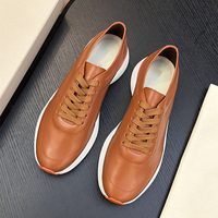 Sepatu Sneakers Pria Premium Kulit Asli Putih Sol Tebal Mewah Aksen Oranye untuk Jalan Santai Sehari-hari