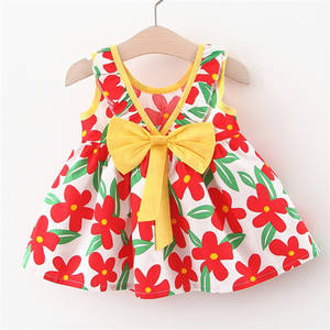 Precio al por mayor Falda de verano europea de algodón hasta la rodilla para niñas, con lazo, estampado completo, corta por delante y larga por detrás, con volantes, para niña de las flores/bebé - Product Image 1