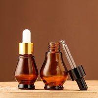 Vente en gros de flacons cosmétiques en verre ambré en forme de gourde de 50 ml, imprimés à l'écran, avec couvercle doré et pulvérisateur à pompe pour le stockage de lotion