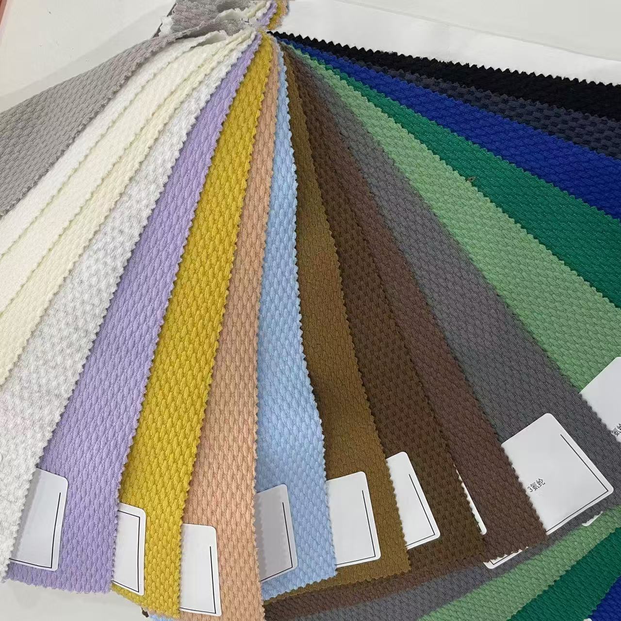 ANONO High Quality New Arrival Polyester Spandex Ant Crepe Embossed Knitted Fabric Sportswear Elastic Textile Fabrics for Dress
