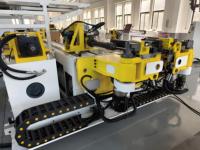 Ligne de production de bras robotisés CNC à double tête pour le cintrage gauche et droit pour l'appui-tête de voiture Machine à cintrer les tuyaux et les tubes