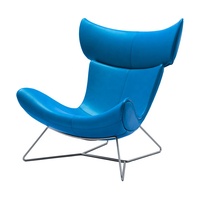 Chaise Imola Boconcept avec repose-pieds, pieds en métal massif chromé, robuste