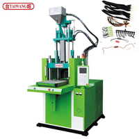 Machine de moulage par injection à table coulissante verticale hydraulique contrôlée par PLC TAIWANG pour la fabrication de fermetures éclair en PP/PVC/PA/PE/PC