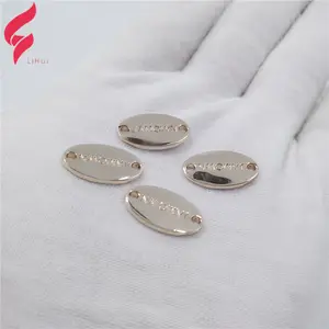 Étiquettes métalliques personnalisées avec Logo, plaque nom en métal pour vêtements, Logo de forme ovale, Logo pour maillot de bain, mode, haute qualité, pièces