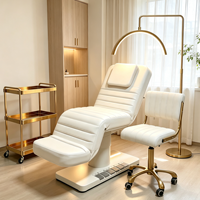 Table de massage électrique réglable blanche moderne et luxueuse pour salon de beauté, spa, soins du visage et cosmétiques