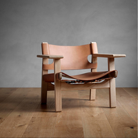 Fauteuils de salon en cuir véritable et bois massif, design vintage de haute qualité, confortables et modernes, conçus par des designers excellents.