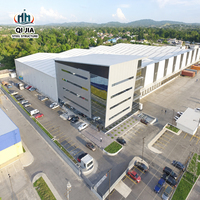 Bâtiment préfabriqué en structure métallique, entrepôt, usine, atelier avec porte enroulable