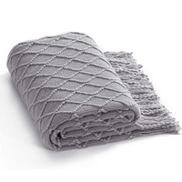 Vente en gros de couvertures décoratives en tricot à franges 100% acrylique texturé uni pour la maison, chaise, canapé, lit