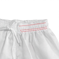 Uniforme de karaté en gros respirant et infroissable, personnalisable avec logo, échantillon disponible pour enfants et adultes, idéal pour l'entraînement en dojo et les arts martiaux.