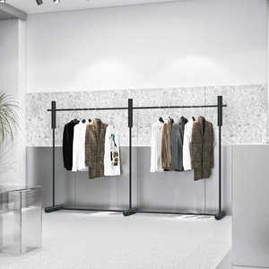 Étagères de présentation pour magasins de vêtements : rails à vêtements en acier inoxydable noir, étagères d'îlot de présentation sur pied blanches - Product Image 3