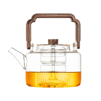 Vente en gros de bouilloire à thé en verre transparent de grande capacité Caractéristique commerciale Bouilloires à eau Manche en bois pichet pour infusion de fruits et thé