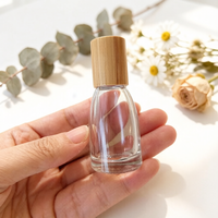 Bouteille à bille en verre transparent de 10ml avec couvercle en bambou et bouteille de parfum d'huiles essentielles de forme spéciale de rouleau en acier à vendre