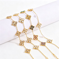 Bracelet tendance à quatre pétales de fleurs, style européen, en acier inoxydable plaqué noir avec accents de zircon pour femme