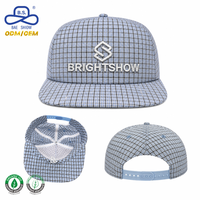 Casquette Snapback à visière plate en tissu à carreaux personnalisée avec logo en relief et œillets contrastants pour usine OEM de marques
