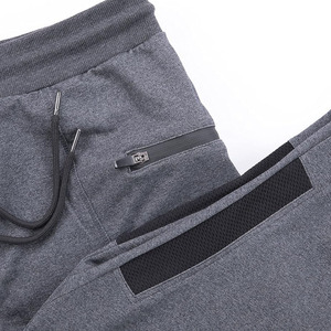Jogging de sport respirant de haute qualité pour hommes, coupe slim, gris, avec poches latérales et taille élastique. - Product Image 3