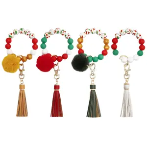 Llaveros de coche, accesorios de diseño de Navidad, roja y verde de silicona, llavero de borla con bola, gran oferta