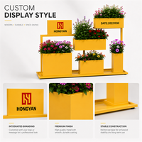 Support de présentation de plantes en métal jaune moderne et durable, résistant à l'eau, pour centre commercial, jardinières à plusieurs niveaux, logo personnalisé, mobilier d'extérieur