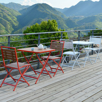 Ensemble table et chaises pliantes en fer, style minimaliste moderne pour l'extérieur, idéal pour cafés, salons de thé, balcons - trois pièces au total