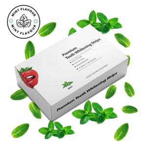 Meilleur vendeur 28 bandes traitement de blanchiment des dents de qualité supérieure à action rapide 14 jours bandes de blanchiment des dents à saveur fraise et menthe naturelles - Product Image 1