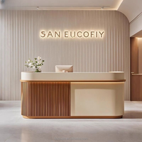 Bureau de réception moderne en bois avec façade en pierre et éclairage LED, pour salons de beauté, bureaux, hôpitaux, hôtels et écoles. Mobilier de bureau.