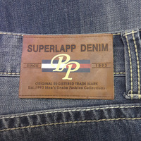 Étiquettes personnalisées en cuir véritable pour vêtements et jeans, avec logo en PP sérigraphié et estampé à chaud, design en cuir de vachette, fabriquées en Chine
