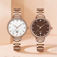 Montre à quartz pour femme, luxe moderne, directement de l'usine, avec verre, bracelet en acier inoxydable, lunette sertie de diamants, aiguilles en forme de feuille, date et fermoir papillon