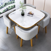 Ensemble de table et de chaises de réception et de négociation à 4 places en pierre artificielle moderne et minimaliste nordique, table à manger décontractée pour hôtel, best-seller