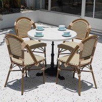 Ensemble de chaises de table de style français pour café d'extérieur et salon de thé Combinaison vintage en rotin pour patio Design pliable en métal pour une assise décontractée