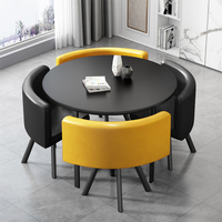 Ensemble de salle à manger moderne et luxueux avec table ronde en bois et 4 chaises rembourrées en métal pour la salle à manger